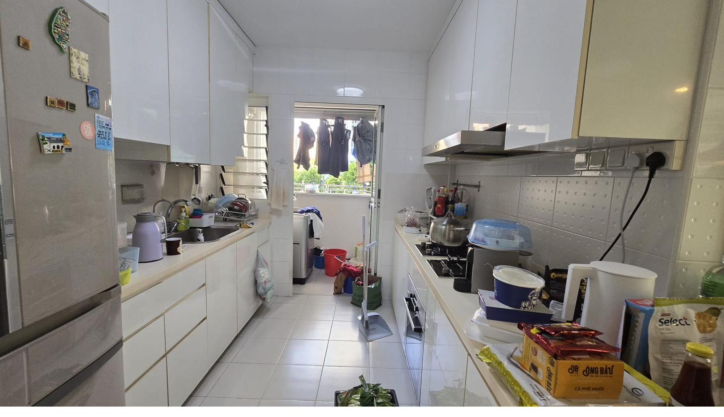 White kitchen before restyle — appliances and clutter on countertops